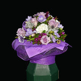 Enjoy this group of mauve roses, freesias and carnations in a self-contained Eco-box. Teresa Brough Designer Florist, Takaka NZ