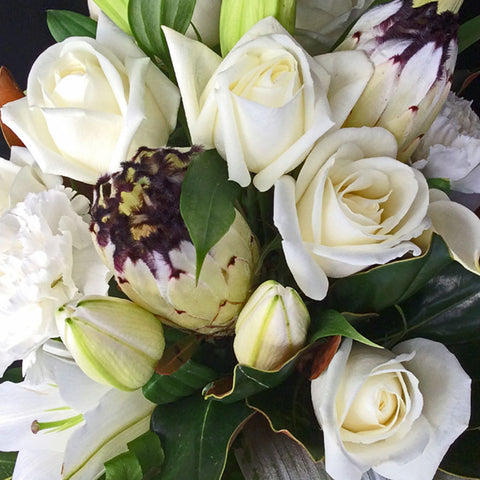 bouquet of white orientals, green chrysanthemums,and white roses